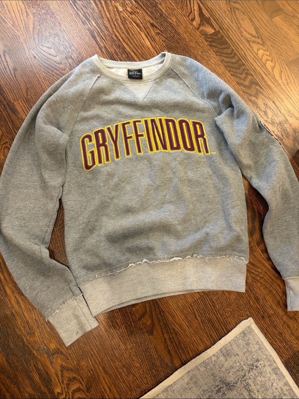 Warner Bros. Gryffindor Gray Crewneck with Maroon & Gold Lettering